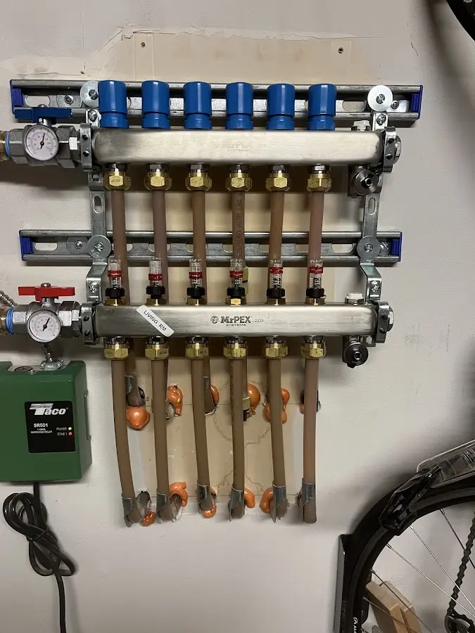 Plumber performing Gas Line Installation at a residential property in Rogers